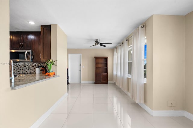 hall with light tile patterned flooring