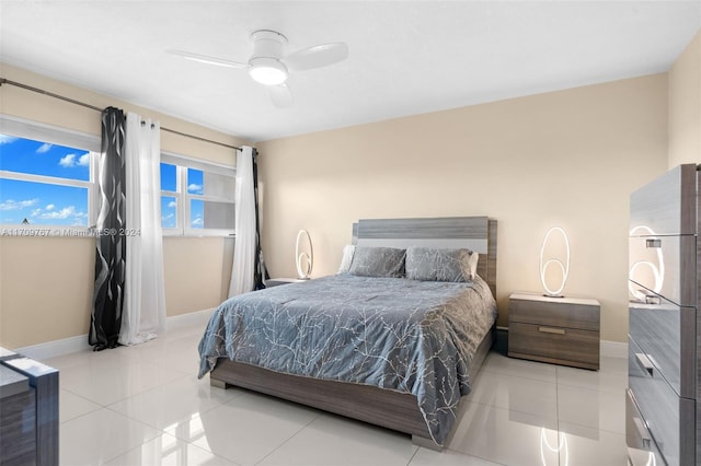 tiled bedroom with ceiling fan