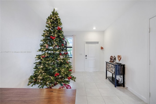 hall featuring light tile patterned flooring