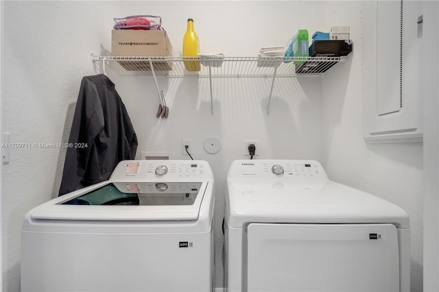 washroom with independent washer and dryer