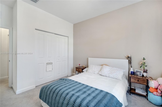 carpeted bedroom with a closet