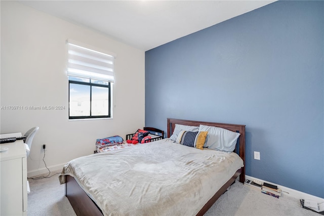 bedroom with light colored carpet