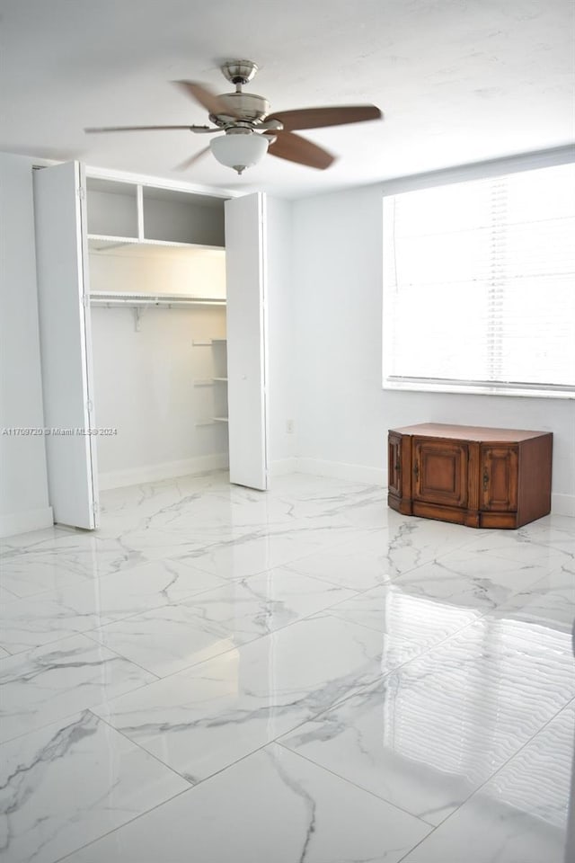 unfurnished bedroom with a closet and ceiling fan