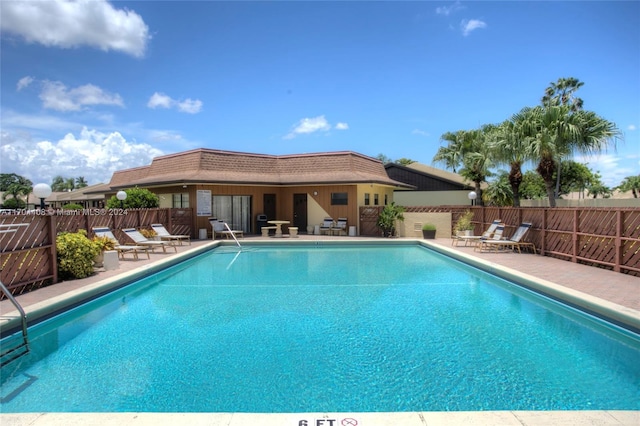 view of pool featuring a patio area