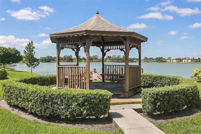 view of dock featuring a gazebo and a water view