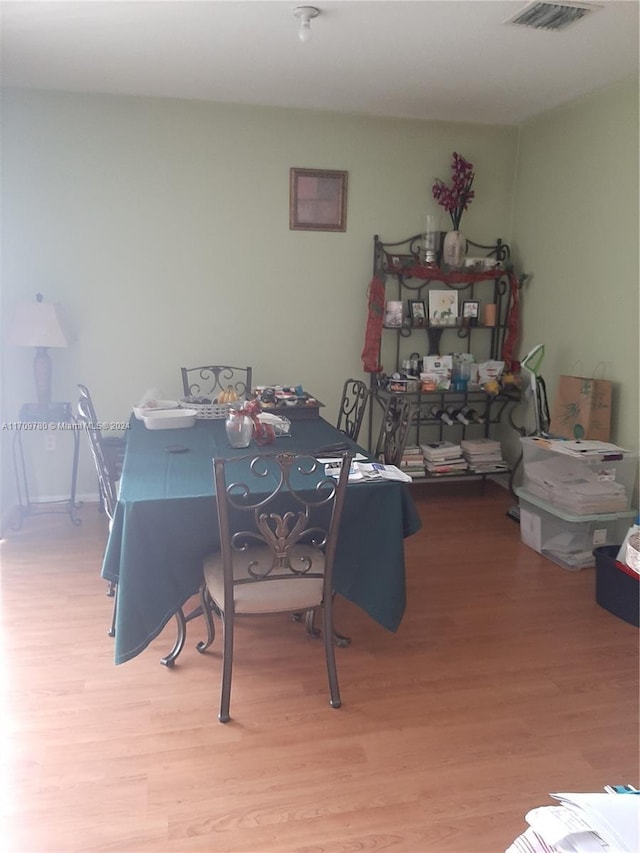 dining space with light wood-type flooring