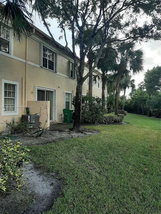 view of yard with central AC unit