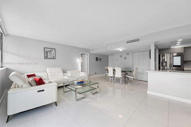 living room with light tile patterned floors