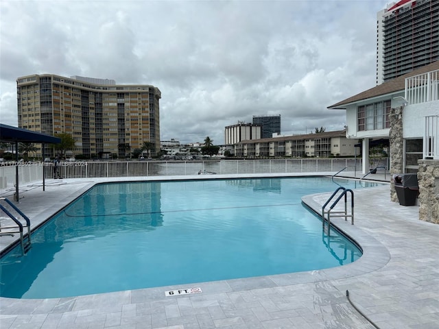 view of swimming pool featuring a patio area