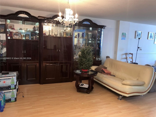 interior space featuring a notable chandelier and light wood-type flooring