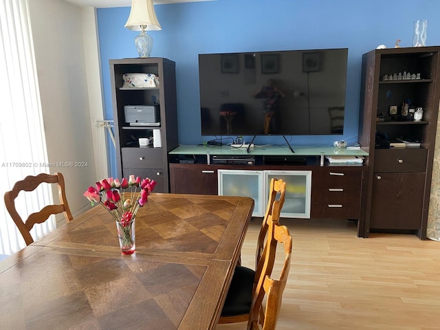 dining area with light hardwood / wood-style floors