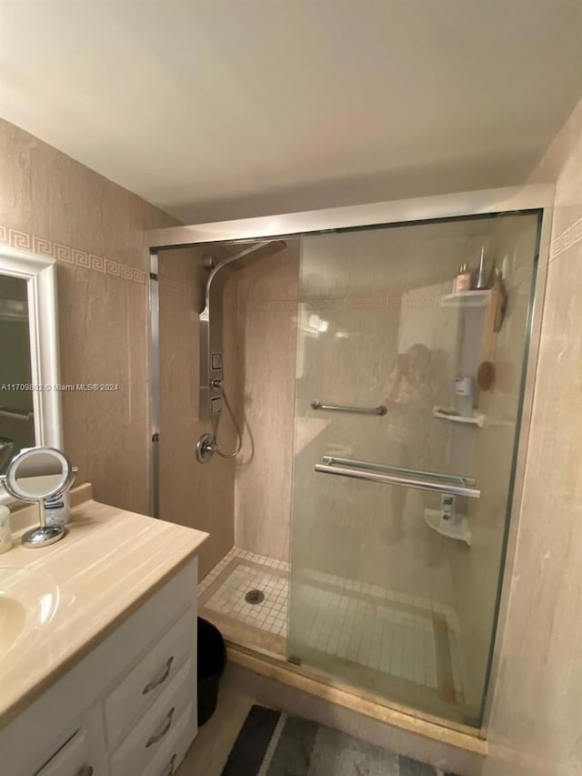 bathroom featuring vanity and walk in shower