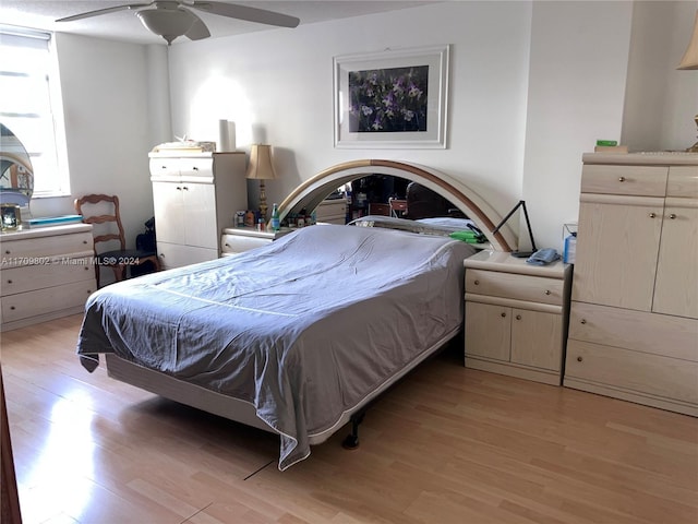 bedroom with light hardwood / wood-style flooring and ceiling fan