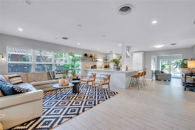 living room with light hardwood / wood-style floors