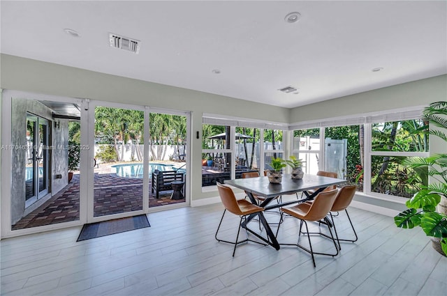 sunroom featuring a healthy amount of sunlight