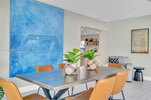 dining area with light hardwood / wood-style floors