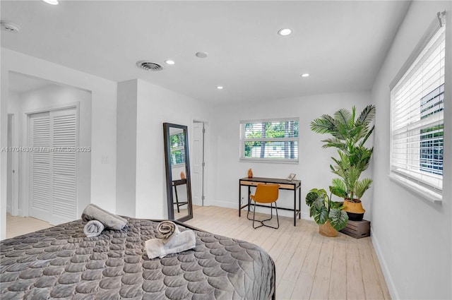 bedroom with light hardwood / wood-style flooring