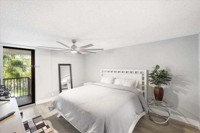 bedroom featuring a textured ceiling, access to outside, ceiling fan, and light hardwood / wood-style floors