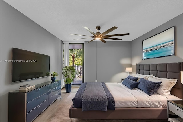 bedroom featuring ceiling fan and light hardwood / wood-style flooring