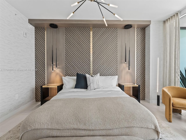 bedroom with a notable chandelier