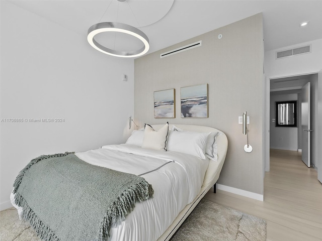 bedroom with light wood-type flooring