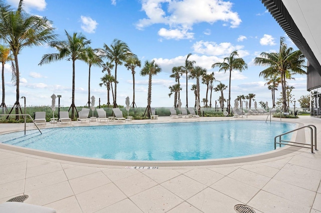 view of swimming pool featuring a patio area