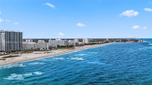 exterior space featuring a water view and a view of the beach