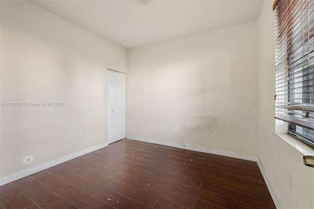 spare room featuring dark hardwood / wood-style floors