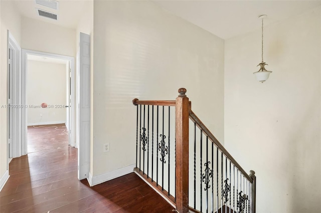 hallway featuring dark wood-type flooring