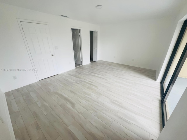 empty room with light wood-type flooring