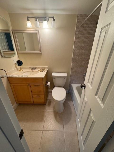 full bathroom featuring toilet, tiled shower / bath combo, tile patterned flooring, and vanity