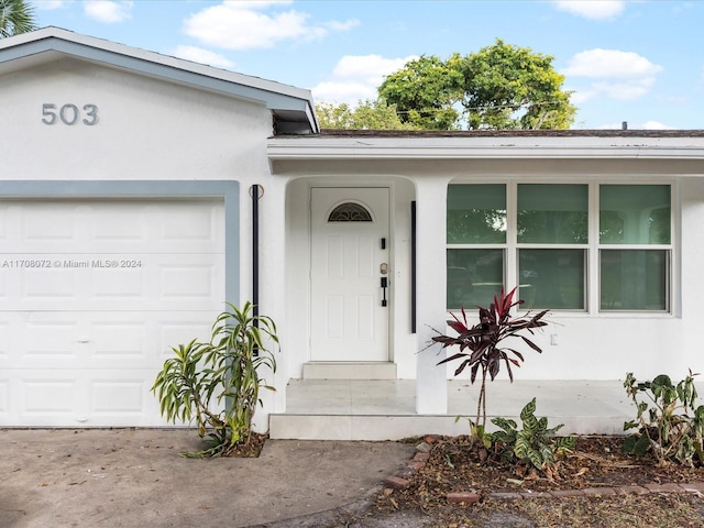 property entrance featuring a garage