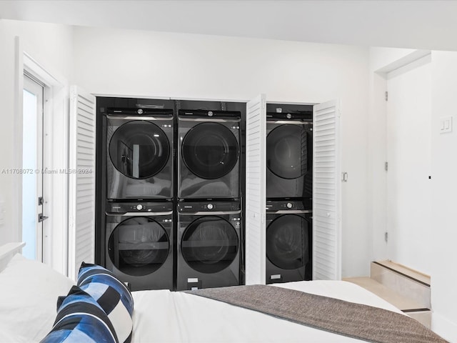 laundry area featuring stacked washing maching and dryer