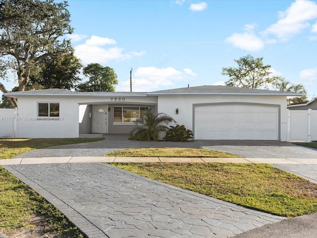 single story home with a garage