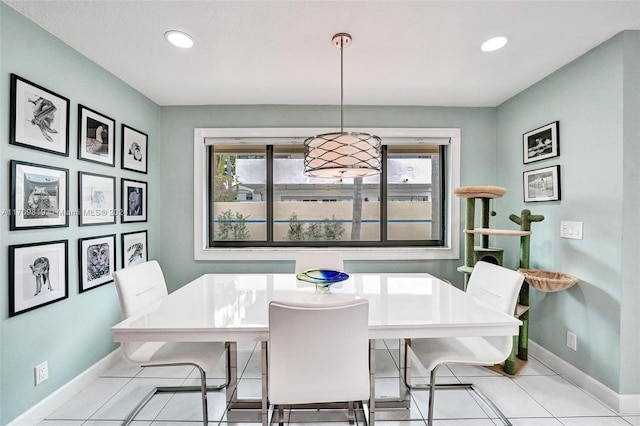 dining area with light tile patterned floors and a healthy amount of sunlight