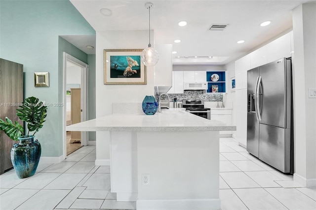 kitchen with modern cabinets, stainless steel appliances, a peninsula, and light tile patterned flooring