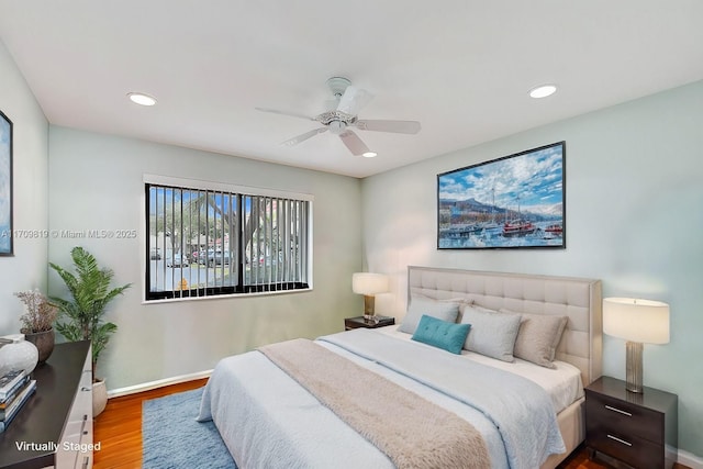 bedroom featuring recessed lighting, baseboards, wood finished floors, and a ceiling fan