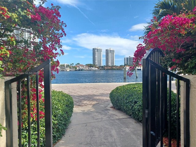 view of gate with a water view