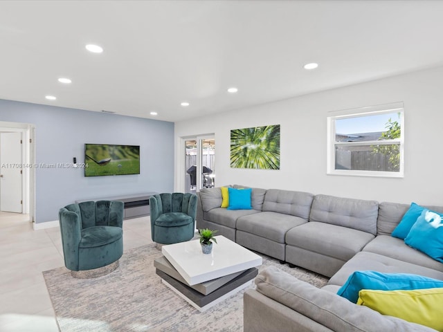 tiled living room with plenty of natural light