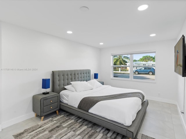 bedroom featuring light tile patterned floors