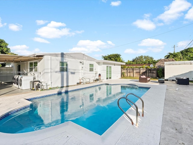 view of swimming pool with a patio