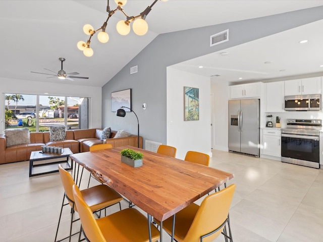 dining area with ceiling fan with notable chandelier and vaulted ceiling