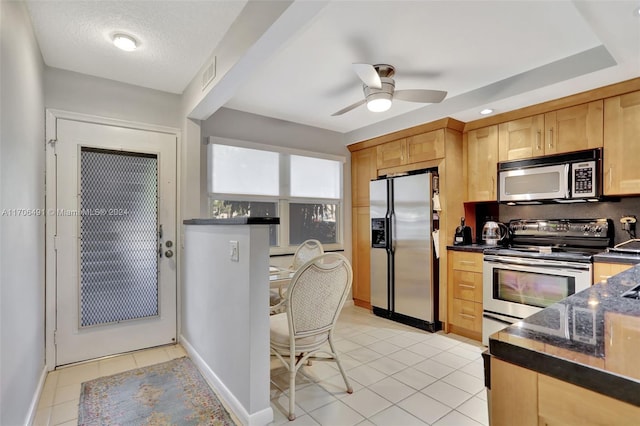 kitchen with ceiling fan, decorative backsplash, light brown cabinetry, light tile patterned floors, and appliances with stainless steel finishes