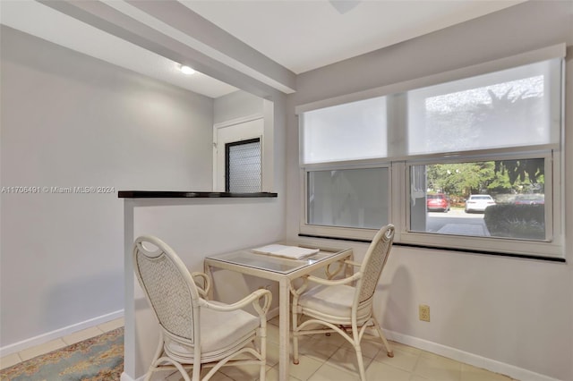 dining space with light tile patterned floors