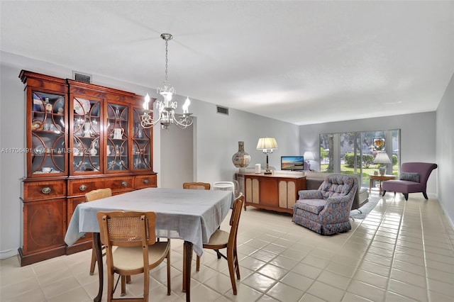 2301 Lucaya Ln Unit M1, Coconut Creek, FL 33066 - dining area with a chandelier