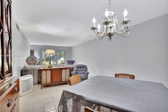 tiled dining area with a notable chandelier