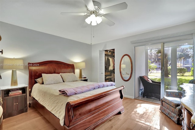 2301 Lucaya Ln Unit M1, Coconut Creek, FL 33066 - bedroom with light wood-style flooring, a ceiling fan, access to exterior, and a walk in closet