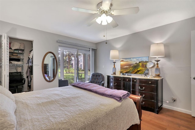 bedroom with ceiling fan and light wood-type flooring