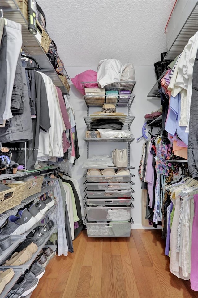 2301 Lucaya Ln Unit M1, Coconut Creek, FL 33066 - walk in closet featuring wood finished floors