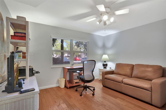 office space with ceiling fan and light hardwood / wood-style floors